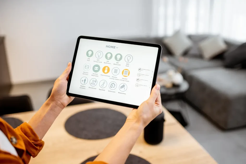 woman controlling smart home devices with a digital tab