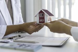 Real estate agent guiding a second home buyer through property choices.