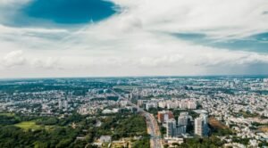Hebbal vs Electronic City Bangalore skyline comparison showing residential growth and infrastructure developmen